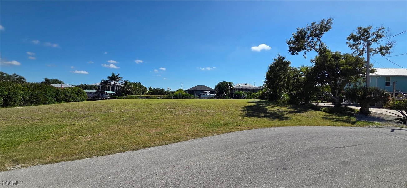 3210 Stabile Road St. James City, FL 33956 - Photo 6 of 14 a view of a lake with a big yard