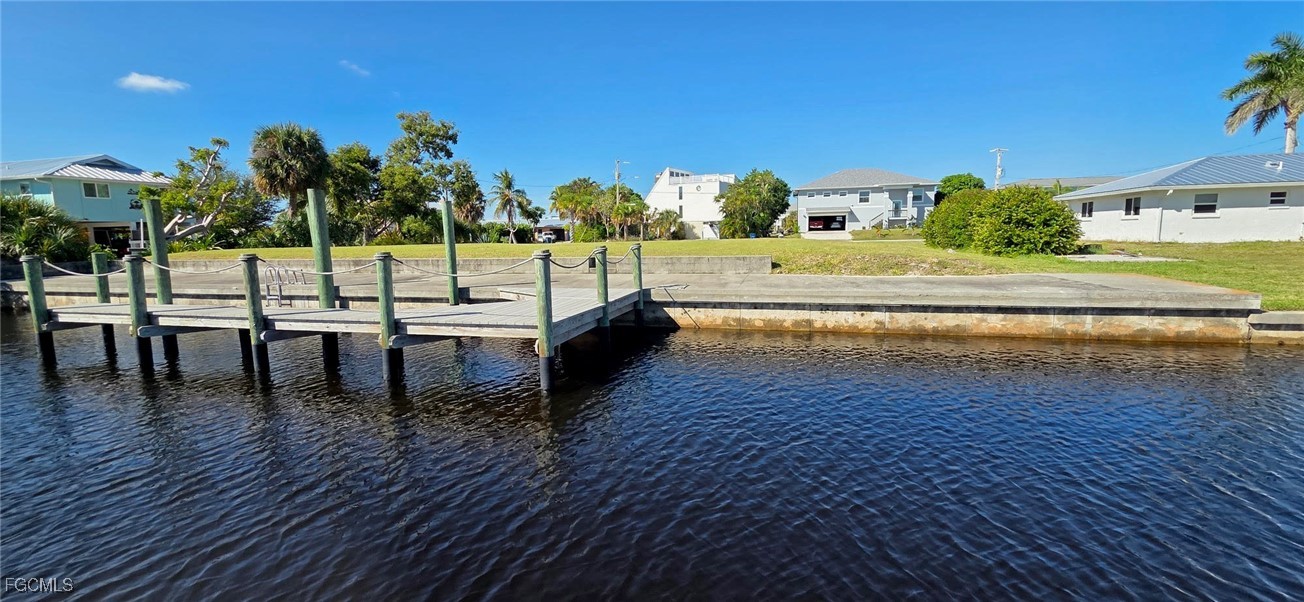 3210 Stabile Road St. James City, FL 33956 - Photo 8 of 14 a view of a swimming pool with a lawn chairs