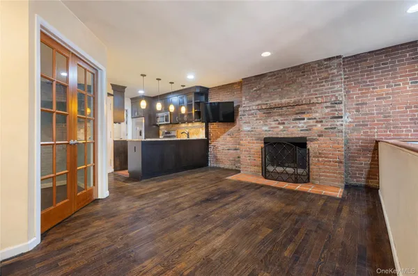 a view of a kitchen with furniture and a fireplace