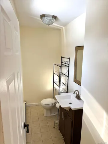 an empty room with wooden floor and closet