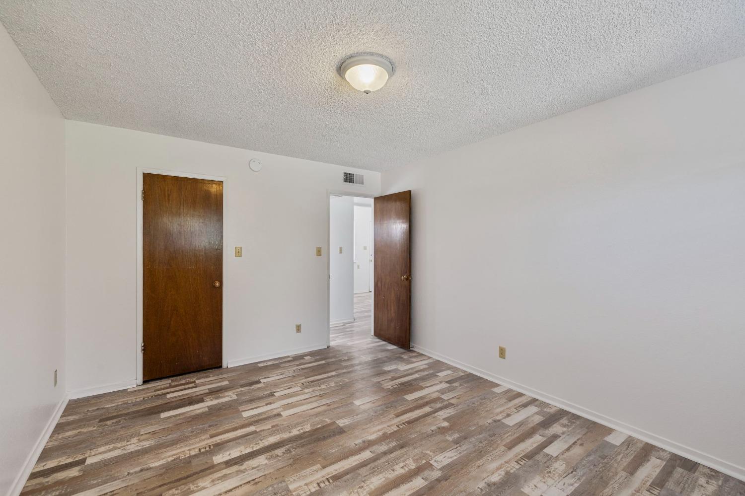 1520 South Reed Avenue Reedley, CA 93654 - Photo 12 of 20 a view of a livingroom with wooden floor