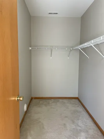 a view of an empty walk in closet