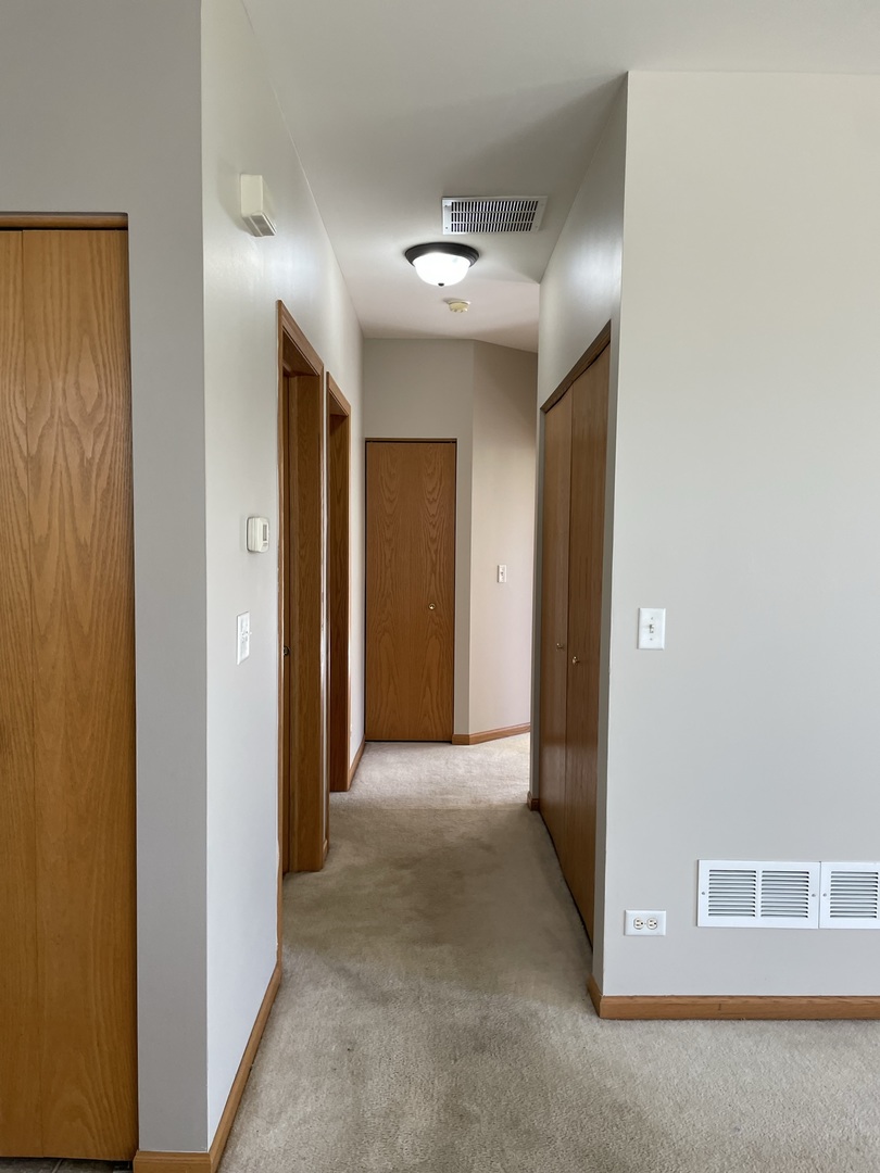 1531 Millbrook Drive Algonquin, IL 60102 - Photo 13 of 14 a view of hallway with closet and wooden floor