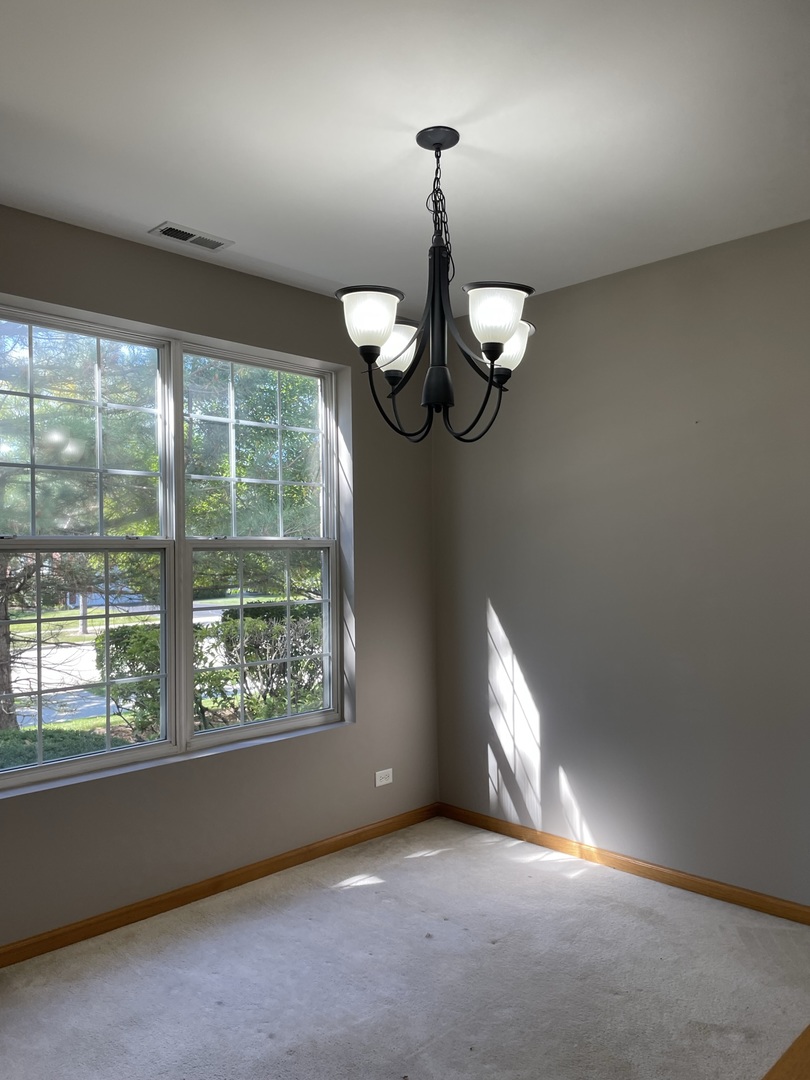 1531 Millbrook Drive Algonquin, IL 60102 - Photo 3 of 14 a very nice looking room with a chandelier