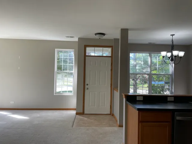 an empty room with windows and outdoor view