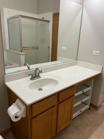 a bathroom with a sink and a mirror