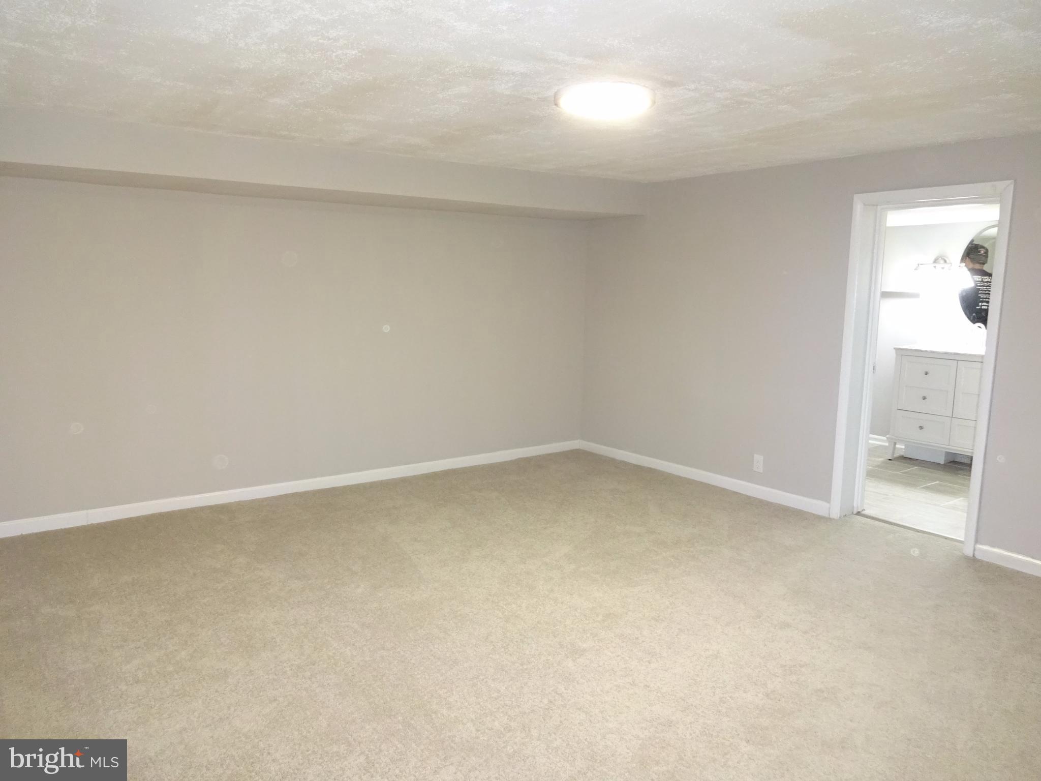 1044 Middleborough Road Baltimore, MD 21221 - Photo 13 of 18 Freshly Painted Family Room w/ New Carpeting