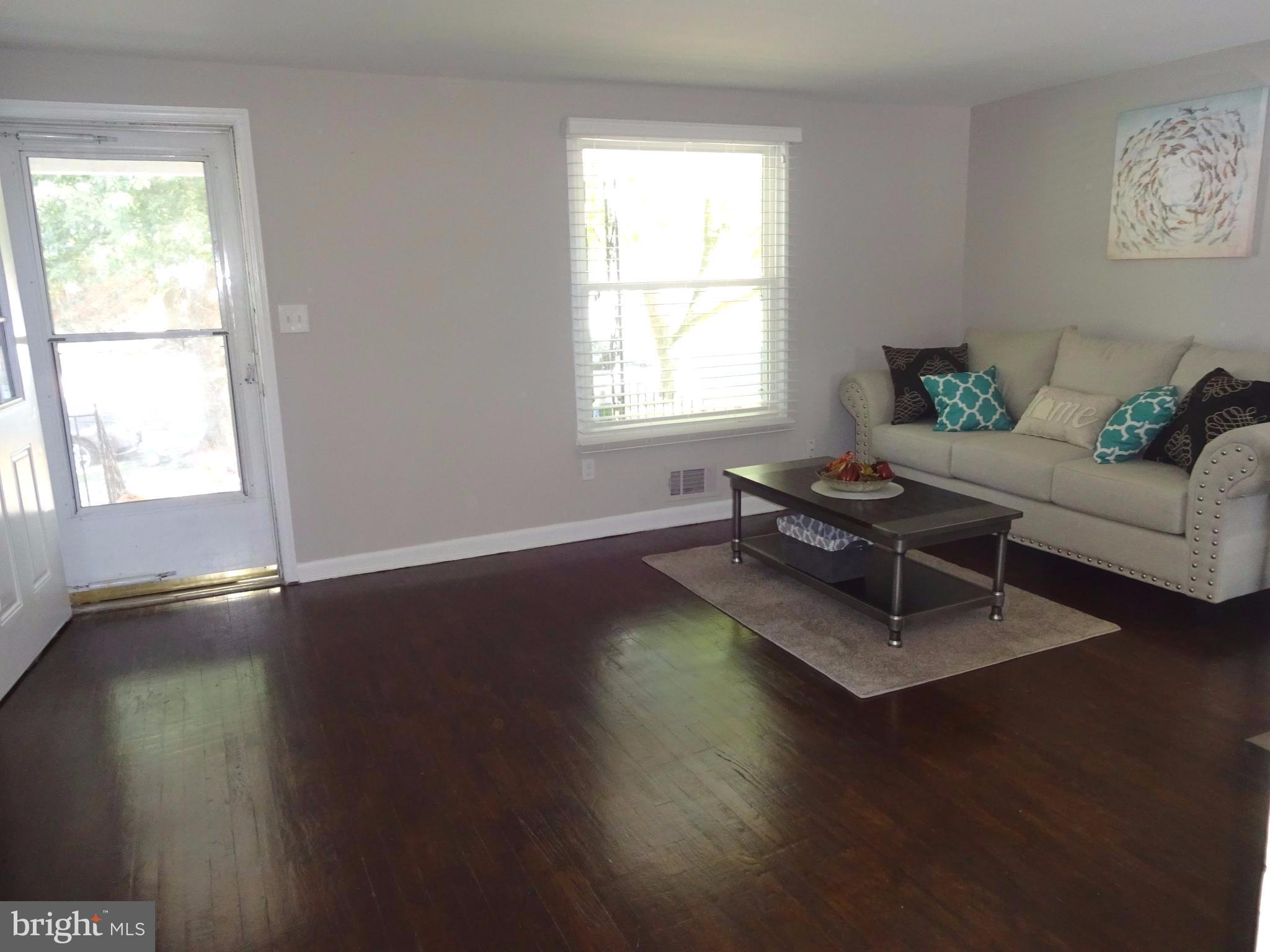 1044 Middleborough Road Baltimore, MD 21221 - Photo 3 of 18 Living Room w/ Hardwood Floors