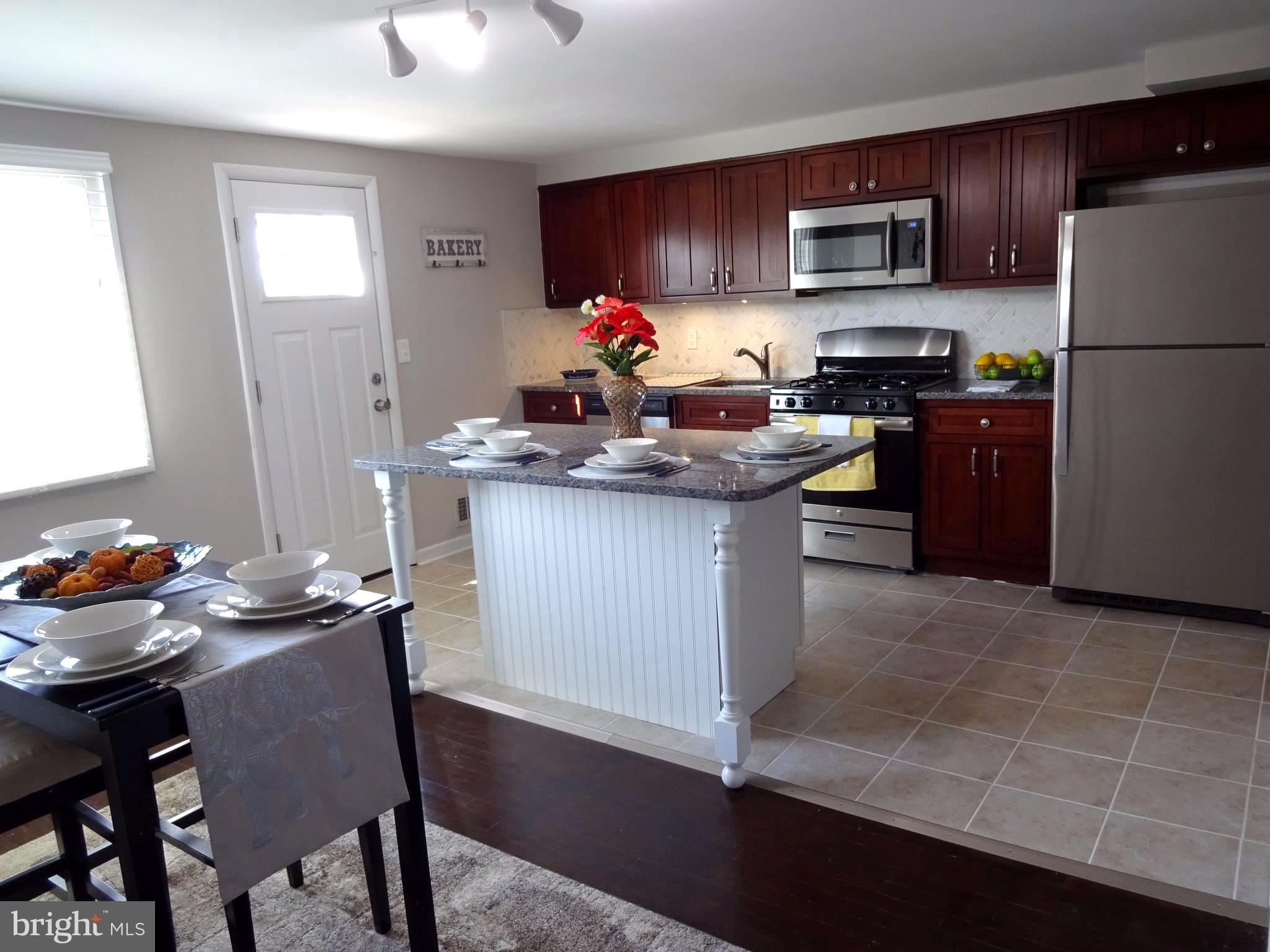 1044 Middleborough Road Baltimore, MD 21221 - Photo 7 of 18 Granite Counters & Ceramic Tile floors