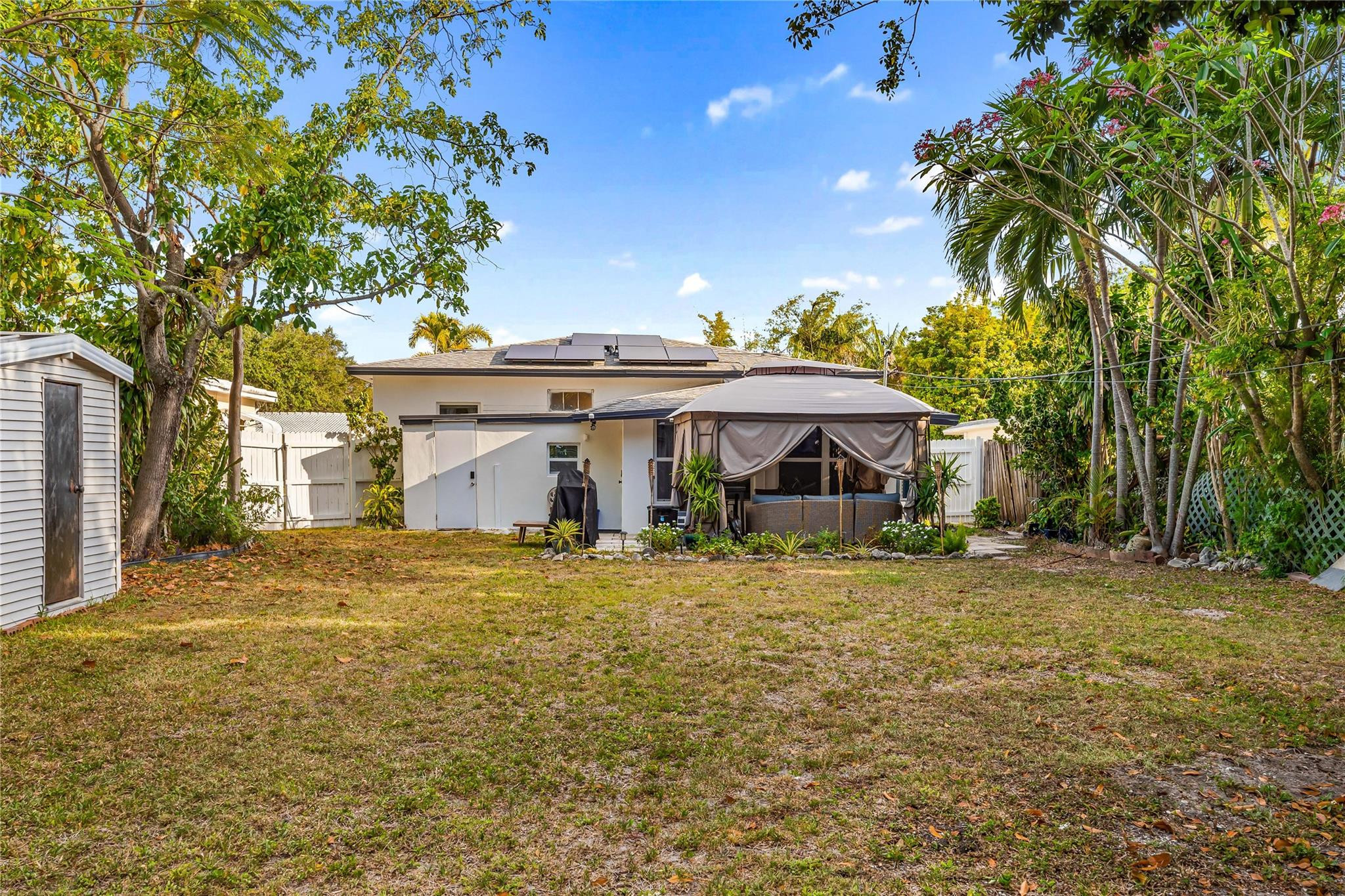 218 Southwest 7th Street Dania Beach, FL 33004 - Photo 55 of 57 a front view of a house with a yard and garage