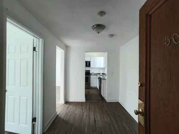 a kitchen with a sink stove and microwave