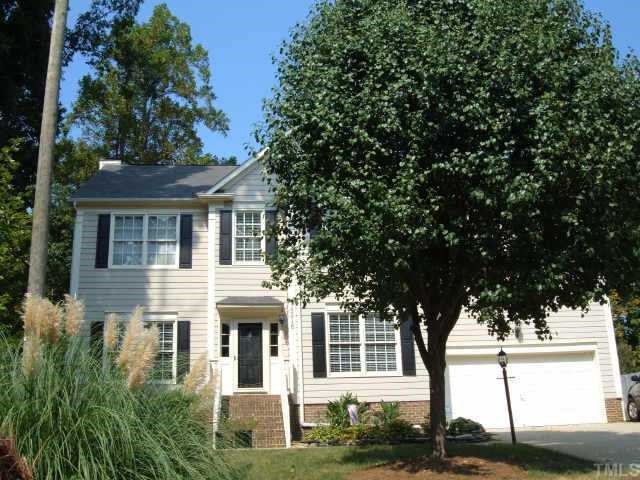 4216 Sprucedale Drive Raleigh, NC 27613 - Photo 1 of 1 a front view of a house with a tree