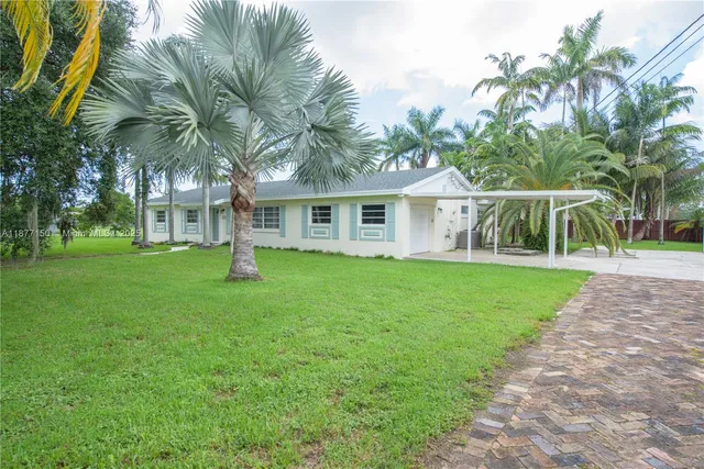 a view of house with a garden