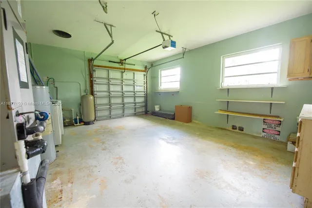 a view of a room with window and furniture