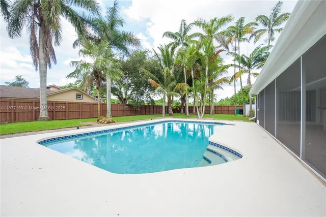 a view of a swimming pool with a backyard