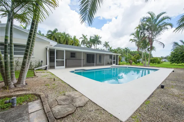 a view of a house with a swimming pool