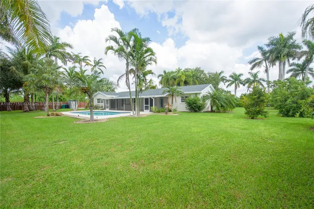 a view of house with a garden