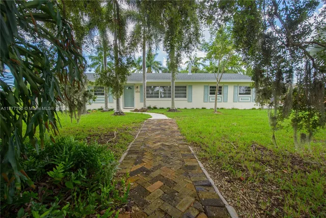 front view of a house with a yard