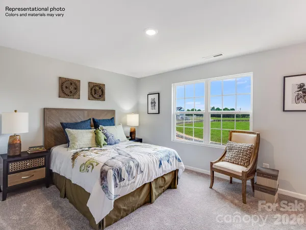 a bedroom with a bed and a couch