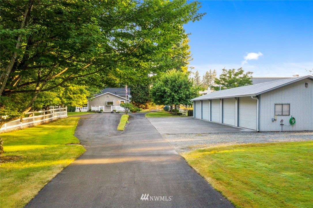 1125 Dyer Road Sultan, WA 98294 - Photo 2 of 22 a view of back yard of the house with a swimming pool