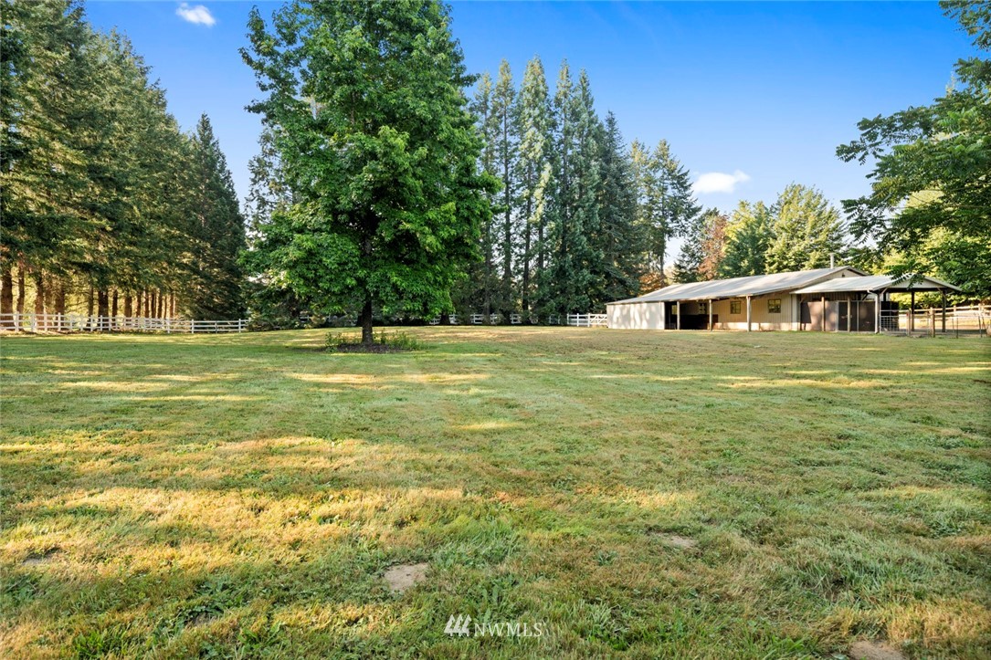 1125 Dyer Road Sultan, WA 98294 - Photo 18 of 22 a view of a house with a yard