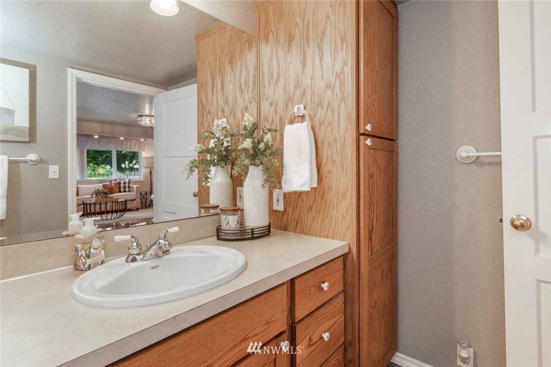 1125 Dyer Road Sultan, WA 98294 - Photo 9 of 22 a bathroom with a sink and a mirror