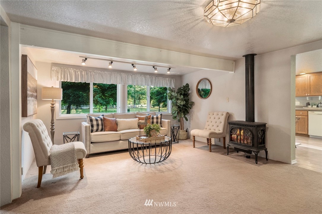 1125 Dyer Road Sultan, WA 98294 - Photo 10 of 22 a living room with furniture and a large window