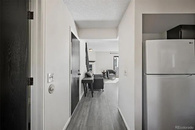 a view of a kitchen from a hallway