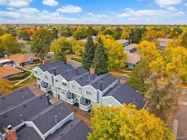 an aerial view of residential houses with outdoor space