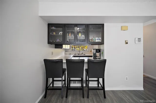 a view of a dining room with furniture and window