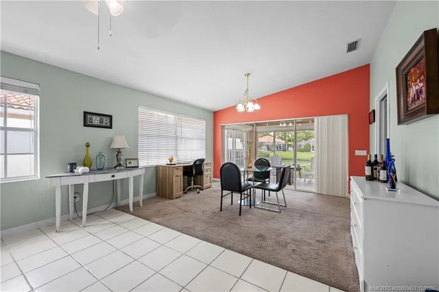 a dining room with furniture and window