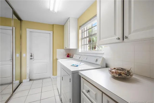 a utility room with washer and dryer