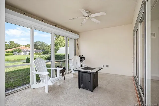 a room with pool table and sofas