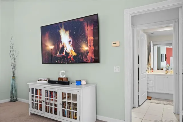 a bedroom with furniture and wooden floor