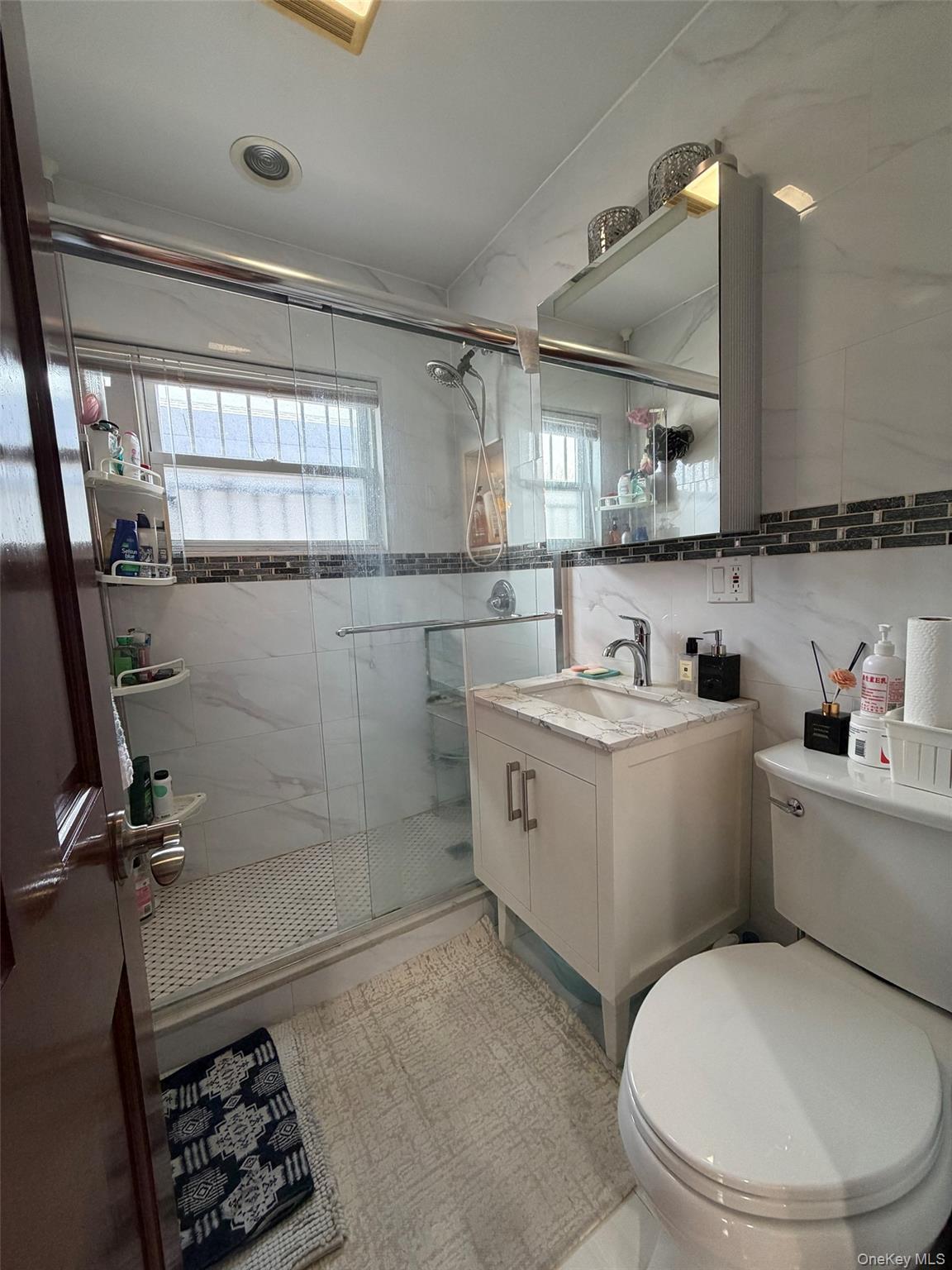 175-28 Underhill Avenue Queens, NY 11365 - Photo 11 of 24 a bathroom with a sink toilet and shower