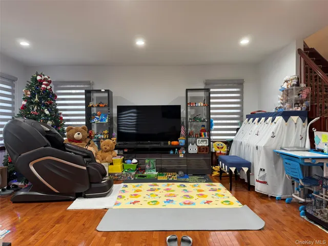 a room with furniture and a flat screen tv