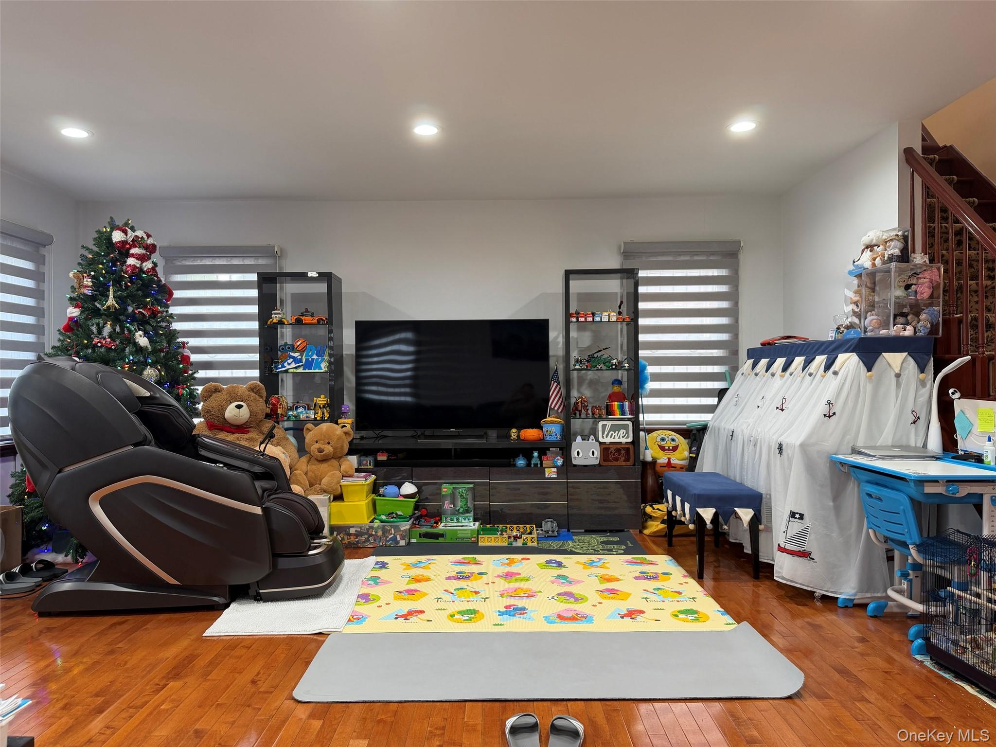 175-28 Underhill Avenue Queens, NY 11365 - Photo 12 of 24 a room with furniture and a flat screen tv