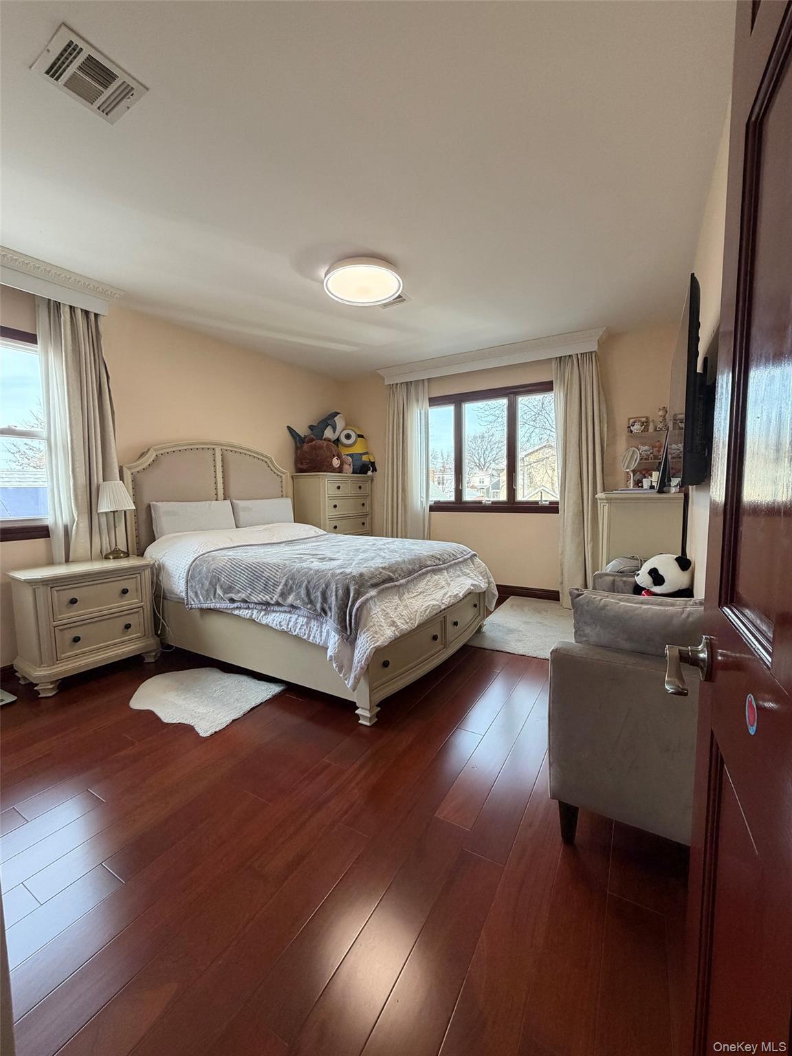 175-28 Underhill Avenue Queens, NY 11365 - Photo 16 of 24 a living room with a bed furniture and a window