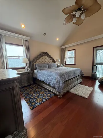 a bedroom with double bed and a window