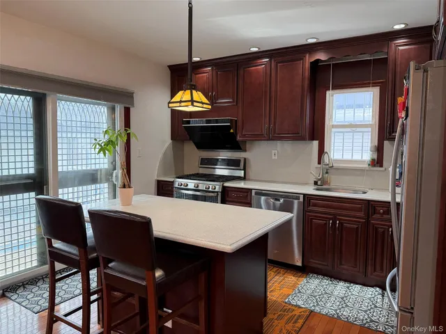 a kitchen with a wooden table and chairs