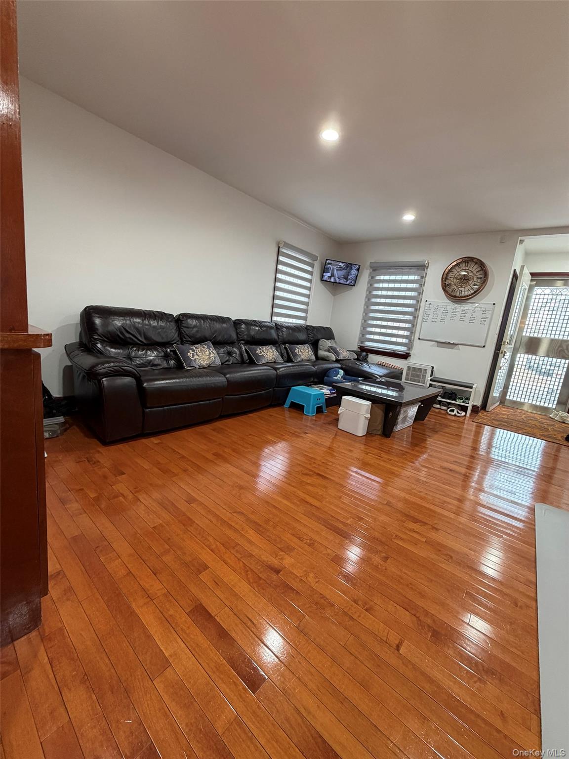 175-28 Underhill Avenue Queens, NY 11365 - Photo 6 of 24 a living room with furniture and a wooden floor