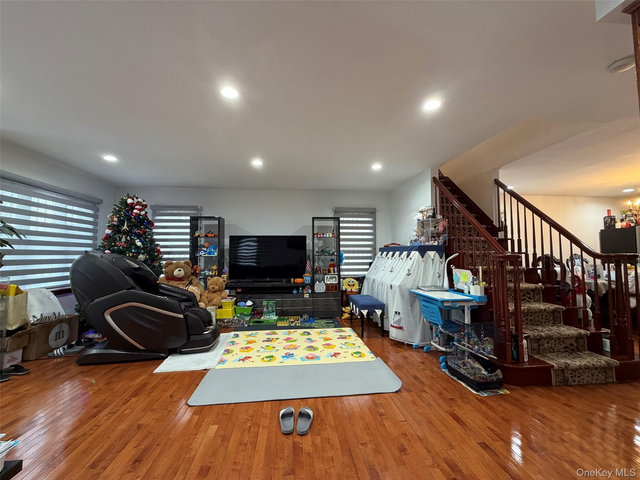 175-28 Underhill Avenue Queens, NY 11365 - Photo 8 of 24 a room with lots of furniture and wooden floor