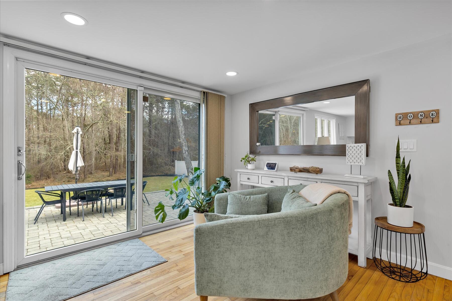 80 Coolidge Road West Yarmouth, MA 02673 - Photo 17 of 37 a living room with furniture and a potted plant