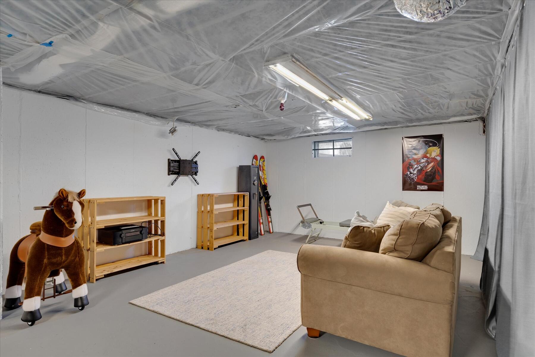 80 Coolidge Road West Yarmouth, MA 02673 - Photo 31 of 37 a living room with furniture and a flat screen tv