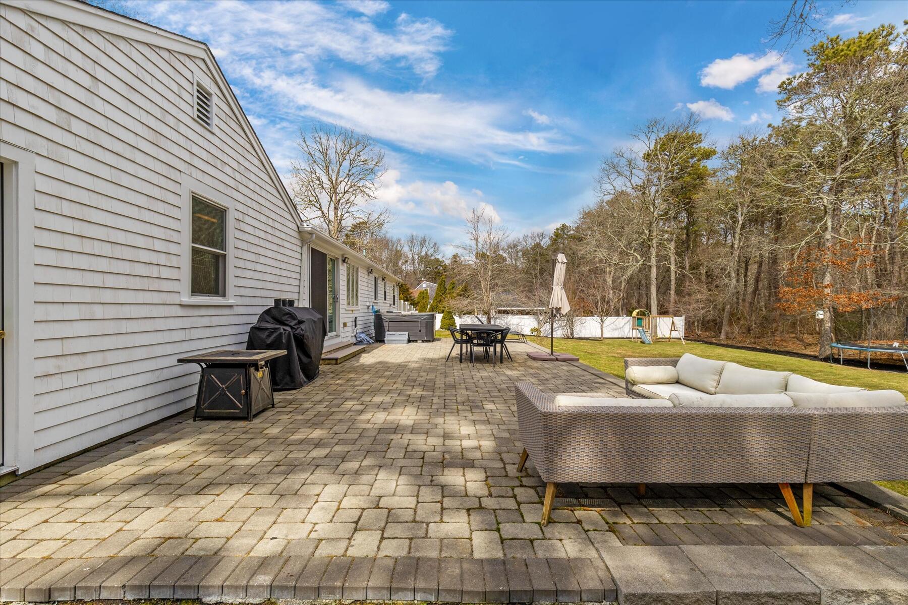 80 Coolidge Road West Yarmouth, MA 02673 - Photo 7 of 37 a view of a patio with swimming pool and sitting area