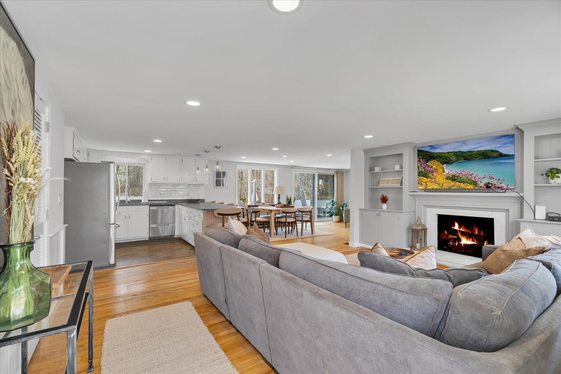 80 Coolidge Road West Yarmouth, MA 02673 - Photo 10 of 37 a living room with furniture and a fireplace
