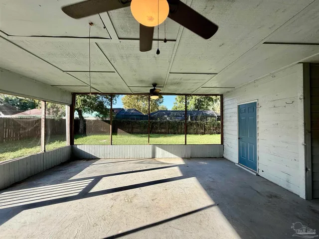 a swimming pool with an outdoor seating and yard
