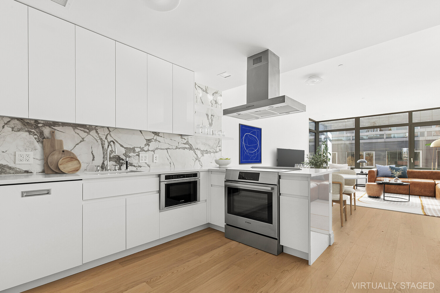 a kitchen with stainless steel appliances granite countertop a stove and white cabinets