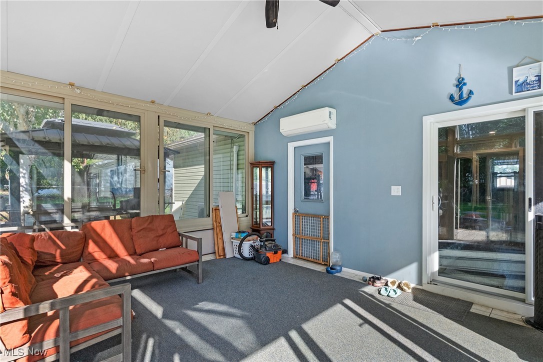 7944 Middle Ridge Road Madison, OH 44057 - Photo 27 of 31 Sunroom / solarium featuring lofted ceiling and a wall mounted air conditioner