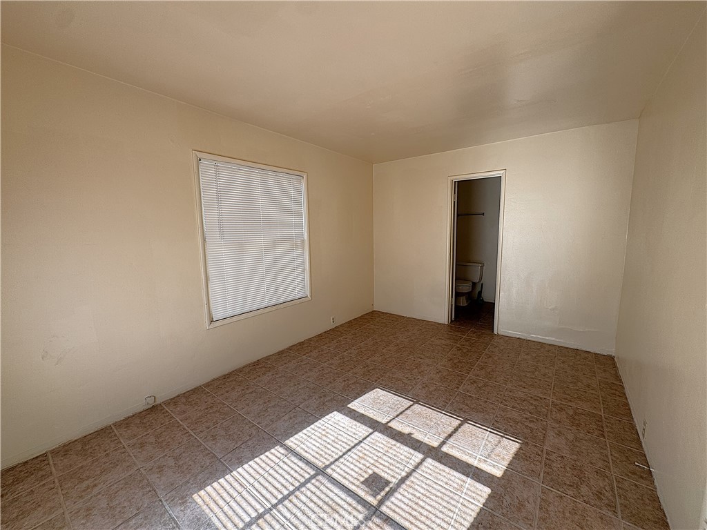521 East Williams Street Barstow, CA 92311 - Photo 17 of 26 a view of an empty room and window